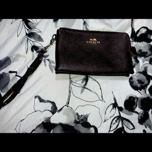 Authentic coach wallet. Some wear and tear on wrist strap and on corners.